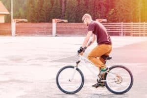 adult riding bmx bike