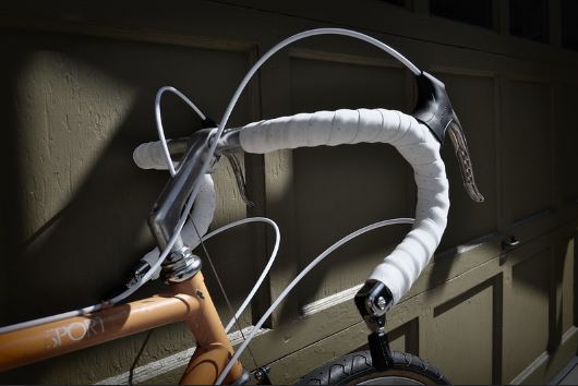 Downtube shifters vs. Bar end shifters - Bar end shifters on a white wrapped handlebars
