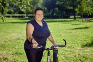 plus size woman with a bike - best bikes for plus size women